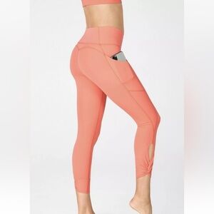 Fabletics Oasis PureLuxe High-Waisted Twist 7/8 Leggings Coral Haze Women’s Med